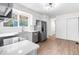 Modern kitchen with white cabinets, stainless steel appliances, granite countertops, and bright lighting fixtures at 1519 S Sable Blvd # C, Aurora, CO 80012