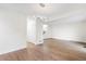 Large living room with modern chandelier, light wood flooring, freshly painted walls, and staircase to upper level at 1519 S Sable Blvd # C, Aurora, CO 80012