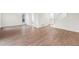 Open living area with light wood flooring, freshly painted neutral walls, and staircase to the upper level at 1519 S Sable Blvd # C, Aurora, CO 80012