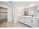 Modern bathroom with double vanity and a large shower at 3372 N Buchanan Way, Aurora, CO 80019
