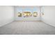 Bright bedroom with neutral carpeting and multiple windows at 3372 N Buchanan Way, Aurora, CO 80019