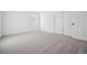 Spacious bedroom with neutral carpeting and a large window at 3372 N Buchanan Way, Aurora, CO 80019