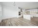 Dining room with hardwood floors and access to kitchen and living room at 3372 N Buchanan Way, Aurora, CO 80019