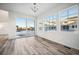 Bright dining room with hardwood floors and sliding glass doors to backyard at 3372 N Buchanan Way, Aurora, CO 80019