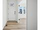 Light and airy entryway with modern white door and flooring at 3372 N Buchanan Way, Aurora, CO 80019