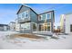 Two-story home with gray siding and patio at 3372 N Buchanan Way, Aurora, CO 80019