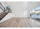 Bright and airy living room with hardwood floors and large windows at 3372 N Buchanan Way, Aurora, CO 80019