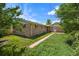 Spacious backyard with lush lawn and mature trees, offers a private outdoor space at 6432 Zephyr St, Arvada, CO 80004