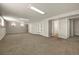 Spacious finished basement area featuring neutral carpeting and recessed lighting fixtures at 6432 Zephyr St, Arvada, CO 80004