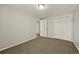 Bedroom featuring neutral walls, carpeting, and a closet at 6432 Zephyr St, Arvada, CO 80004