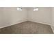 Carpeted bedroom with window and neutral colors at 6432 Zephyr St, Arvada, CO 80004
