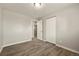 Neutral bedroom features wood-look floors and a closet, providing ample storage at 6432 Zephyr St, Arvada, CO 80004