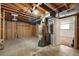 Unfinished basement area featuring exposed ceiling joists and a concrete floor at 6432 Zephyr St, Arvada, CO 80004