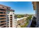 Beautiful balcony view overlooking the city, trees, and surrounding buildings with a blue sky at 1121 Albion St # 809, Denver, CO 80220