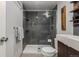 Modern bathroom features a glass enclosed shower with sleek dark gray tile surround at 1121 Albion St # 809, Denver, CO 80220