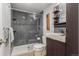 Modern bathroom features a glass enclosed shower with sleek dark gray tile surround at 1121 Albion St # 809, Denver, CO 80220