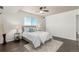 Comfortable bedroom featuring hardwood floors, a ceiling fan, and great natural light at 1121 Albion St # 809, Denver, CO 80220