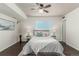 This bedroom features hardwood floors, a ceiling fan and large window providing ample natural light at 1121 Albion St # 809, Denver, CO 80220
