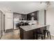 Updated kitchen with stainless steel appliances, modern cabinets, and a breakfast bar at 1121 Albion St # 809, Denver, CO 80220
