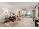 Bright living room with balcony access, a comfortable seating area, and stylish decor at 1121 Albion St # 809, Denver, CO 80220
