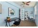 This well-lit office has a modern light fixture, built-in shelving, and a full sized closet at 1121 Albion St # 809, Denver, CO 80220