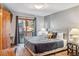 Cozy bedroom featuring plush bedding and a private balcony access, perfect for relaxation at 180 Emmett Lode Rd, Breckenridge, CO 80424