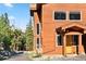 Charming home with a wooden exterior, stone accents, and a well-maintained driveway at 180 Emmett Lode Rd, Breckenridge, CO 80424
