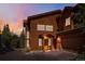 Charming exterior showcasing wood siding, a covered entry, and attached garage, perfect for mountain living at 180 Emmett Lode Rd, Breckenridge, CO 80424