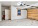 A spacious two-car garage with a side door and a window that allows for natural light at 180 Emmett Lode Rd, Breckenridge, CO 80424