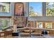 Stylish kitchen featuring granite countertops, modern fixtures, a stone fireplace, and breathtaking mountain views at 180 Emmett Lode Rd, Breckenridge, CO 80424