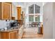 Well-equipped kitchen with granite counters, wood cabinets, stainless steel appliances, and an open layout to the dining area at 180 Emmett Lode Rd, Breckenridge, CO 80424