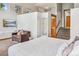 Bright main bedroom with vaulted ceilings and steps to a private bathroom at 180 Emmett Lode Rd, Breckenridge, CO 80424