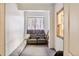 An interior view of a small storage area or room with natural light and seating at 180 Emmett Lode Rd, Breckenridge, CO 80424