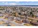 A lovely neighborhood with houses, trees, a distant lake, and a clear blue sky at 7310 S Sheridan Ct, Littleton, CO 80128