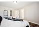 A contemporary bedroom boasts convenient ensuite bathroom access at 7310 S Sheridan Ct, Littleton, CO 80128
