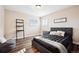 Comfortable bedroom includes large windows and contemporary furnishings at 7310 S Sheridan Ct, Littleton, CO 80128