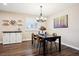 A formal dining room provides ample natural light and a custom wine rack at 7310 S Sheridan Ct, Littleton, CO 80128