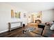 Spacious living area showcases wood-look flooring with stylish decor, offering a welcoming and comfortable atmosphere at 7310 S Sheridan Ct, Littleton, CO 80128