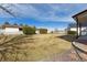 Spacious backyard features manicured lawn, white fencing, green shrubbery, and mature trees at 15935 W 77Th Pl, Arvada, CO 80007