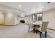 Finished basement featuring carpet, game table with four chairs, and comfortable sitting area at 15935 W 77Th Pl, Arvada, CO 80007