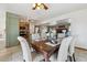 Open-concept dining area adjacent to the kitchen and living room, perfect for entertaining at 15935 W 77Th Pl, Arvada, CO 80007