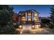Charming two-story home with a brick and white facade, two-car garage, and professionally landscaped yard at 15935 W 77Th Pl, Arvada, CO 80007