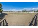 Spacious horse property featuring a large, well-maintained paddock with a white fence at 15935 W 77Th Pl, Arvada, CO 80007