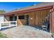 Rustic horse barn with a sliding wood door, providing shelter and storage for equestrian needs at 15935 W 77Th Pl, Arvada, CO 80007