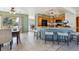Well-equipped kitchen with oak cabinets, granite countertops, and an adjacent breakfast nook at 15935 W 77Th Pl, Arvada, CO 80007