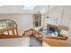 Bright and inviting living room with a fireplace, large windows, and vaulted ceilings at 15935 W 77Th Pl, Arvada, CO 80007