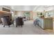 Spacious living room featuring a fireplace, neutral-toned furniture, and ample natural light at 15935 W 77Th Pl, Arvada, CO 80007