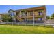 Exterior view of multi-level deck and patio overlooking a spacious backyard at 15975 Quandary Loop, Broomfield, CO 80023
