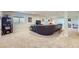 Finished basement featuring recessed lighting, carpet, and large leather couch at 15975 Quandary Loop, Broomfield, CO 80023