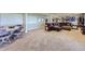 Spacious finished basement with neutral carpet and comfortable seating area at 15975 Quandary Loop, Broomfield, CO 80023